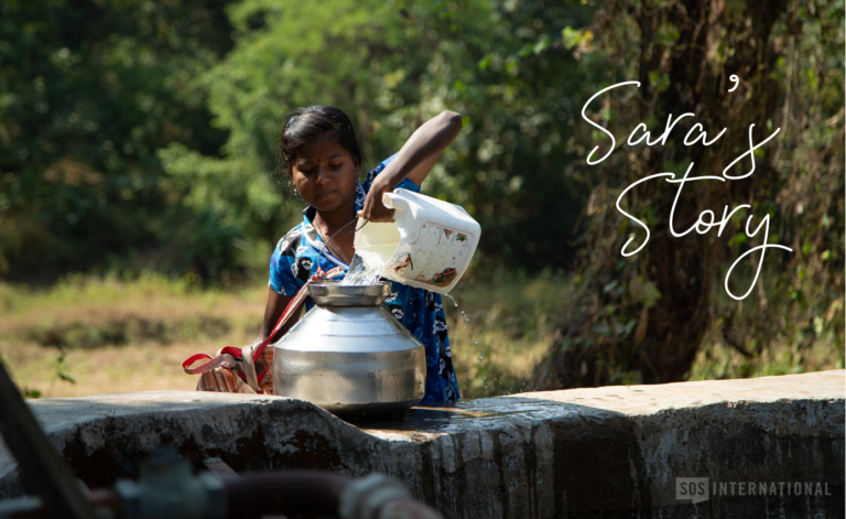 Because she doesn’t have access to a water source in her community, she must make the long trek to an open well shared by several villages.